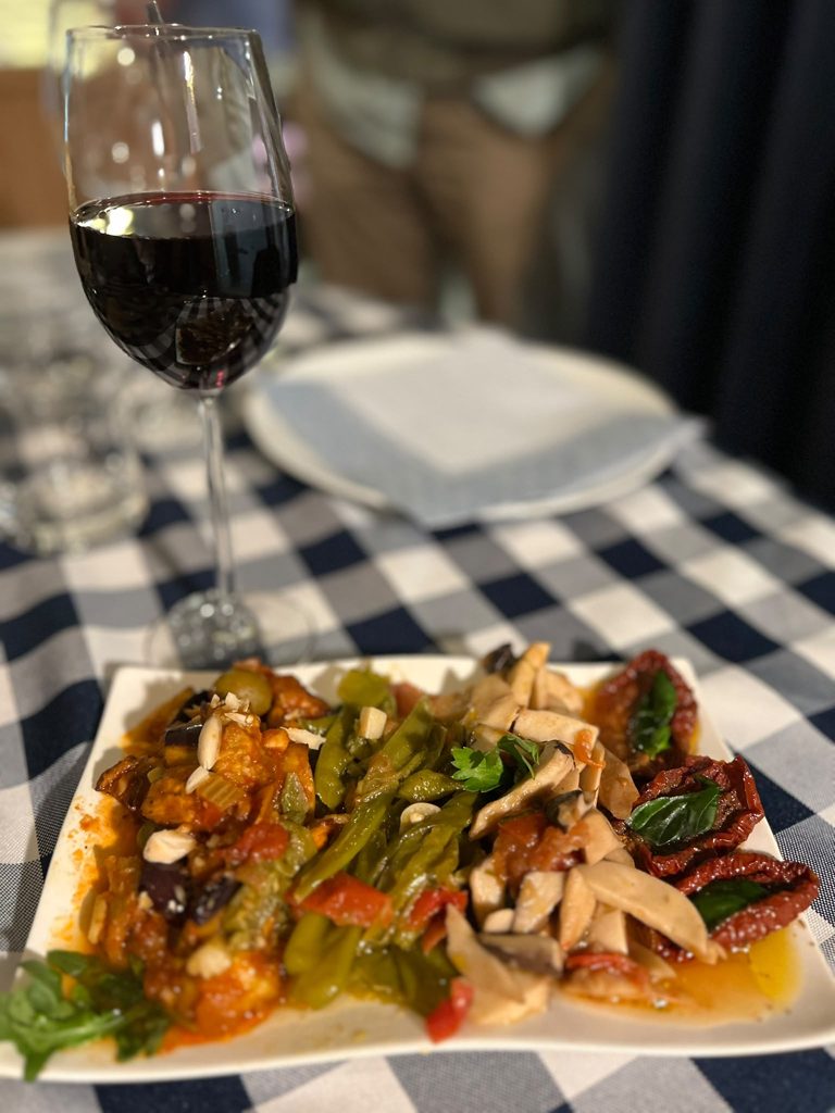 A glass of southern Italian wine at a Modi evening